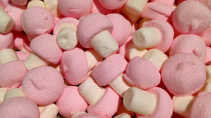 Closeup of pink and white marshmallow mushrooms with strawberry flavour 