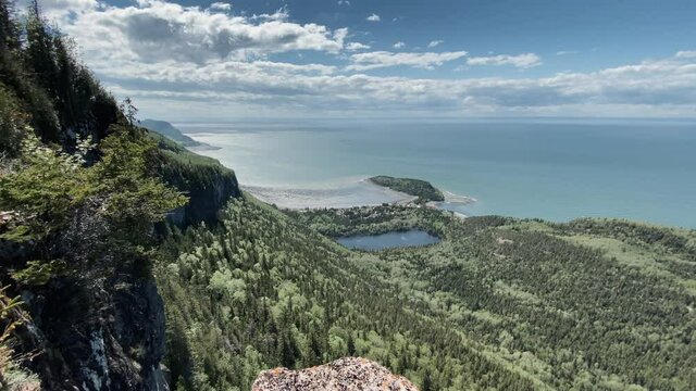 Lush Green Forest By The Coastal Mountains At Bic National Park Surrounded By The Calm Coast In Rimouski, Quebec, Canada. -pan up
