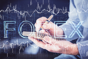 Double exposure hands with stock market chart.