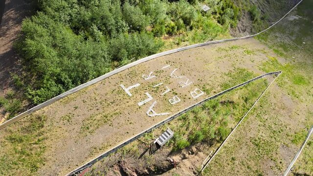 Rotary drone photage of "Everything is going to be ok" in Rena