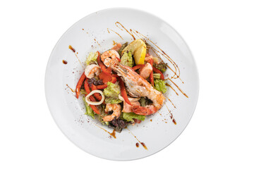 seafood salad on a white plate on a white isolated background. Shrimp, squid, pepper, lemon