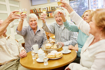 Cheerful group of seniors celebrates exuberantly