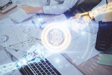 Cryptocurrency hologram over woman's hands writing background. Concept of blockchain. Multi exposure