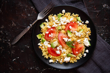 Fresh bulgur salad with tomatoes, avocado and cottage cheese. Vegetarian salad with bulgur