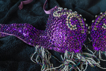 Beautiful purple women's bra with glitters on black fur