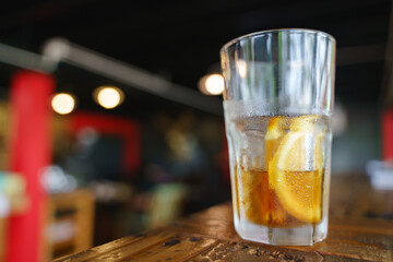 Iced cold brew coffee with slice of orange