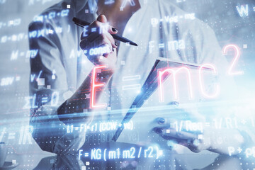 Science formula hologram over woman's hands taking notes background. Concept of study. Double exposure