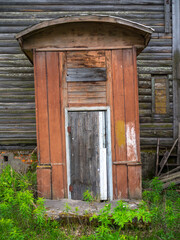 Elements of an old wooden large two-story house.