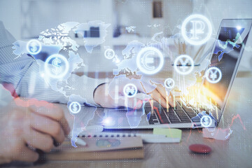 Multi exposure of stock market graph with man working on laptop on background. Concept of financial analysis.