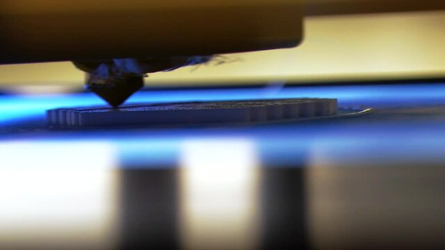 Close Up Shot Of 3D Printer Creating A Design. Futuristic Technology.