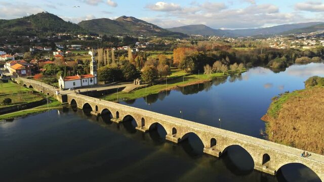 View of Medieval bridge in Lima river. Ponte de Lima. Most older village in Portugal.  Drone Footage