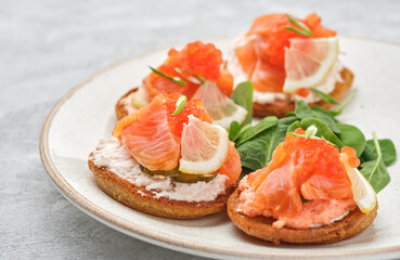 Russian pancakes with salmon and red caviar
