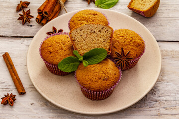 Homemade cupcakes with cinnamon, star anise and fresh mint. Autumn good mood, warm weather