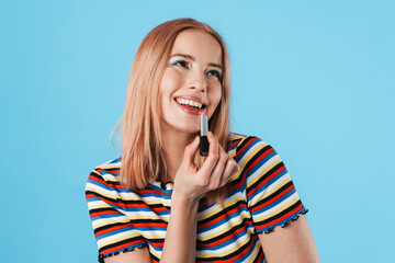 Image of attractive cheerful girl wearing lipstick and smiling