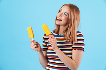 Image of cheerful pretty girl holding ice-cream and laughing