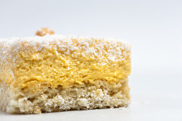 Coconut cake on a plate on white background