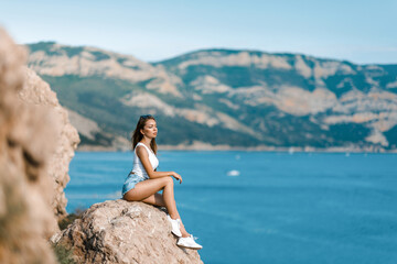 Joyful woman travel mountains. Authentic blond female relax in picturesque landscape