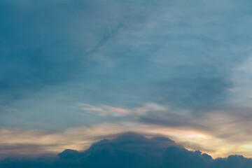 iridescent clouds in the evening before the sunset.