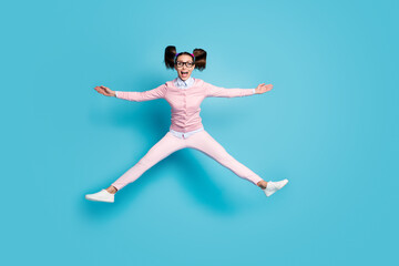 Full length photo of crazy cheerful funny teen high school student jump hold hand wear good look outfit shoes isolated over blue color background