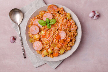 Stewed rice with beans, sausages and vegetables