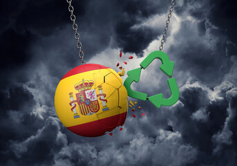 Obraz premium Green recycle symbol crashing into a Spain flag ball. 3D Rendering