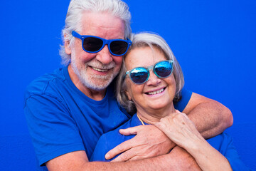 portrait of couple of mature people or seniors together having fun smiling and looking at the...