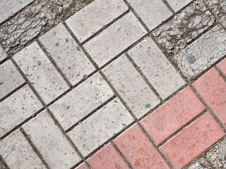 Background image of texture of pedestrian footpath covered by paving tiles
