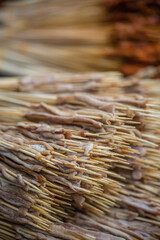 Piles of raw food on sticks on a chinese market