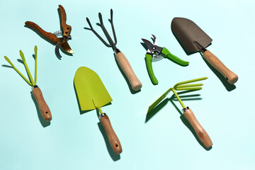 Set of gardening supplies on color background