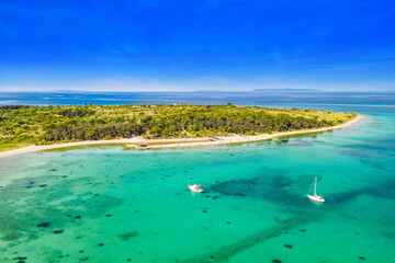 Adriatic sea paradise on the island of Pag in Croatia. Aerial seascape. Sailboats in beautiful bay.