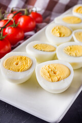 boiled chicken eggs on a dark stone background