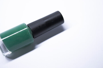 A bottle with blue nail polish on white background. nail lacquer. Nail manicure concept. Isolated, copy space. 