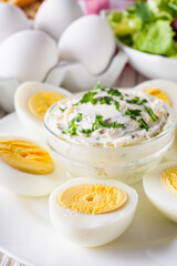 boiled chicken eggs on a white wooden rustic background