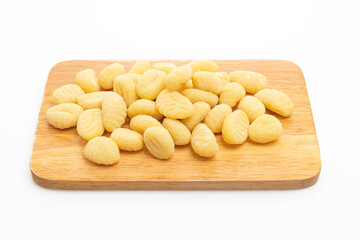 Traditional Italian gnocchi pasta uncooked on white background
