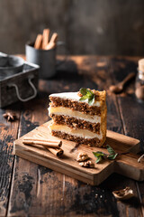 homemade carrot cake on a wooden background, rustic style