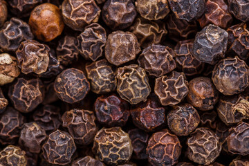 fragrant black pepper on white acrylic background