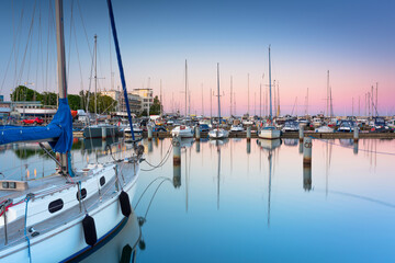 Beautiful sunset over the marina at Baltic Sea with yachts in Gdynia, Poland.