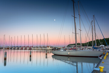 Beautiful sunset over the marina at Baltic Sea with yachts in Gdynia, Poland.