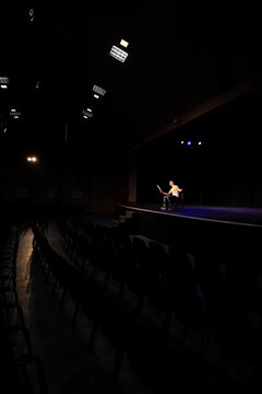 Distant view of student practicing at the theater