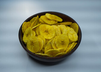 Tasty banana chips in a bowl with nice colur, spicy, crispy, salt.
