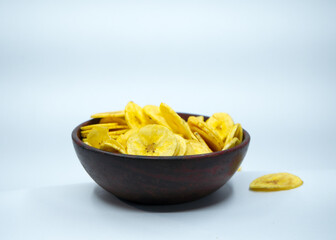 Tasty banana chips in a bowl with nice colur, spicy, crispy, salt.