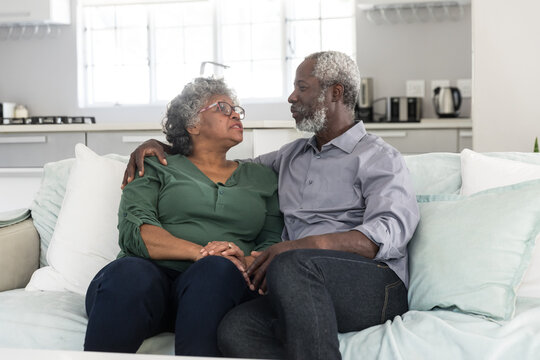 A senior African American couple spending time at home
