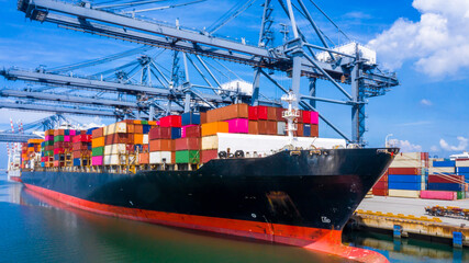 Container cargo ship at industrial port in import export global business worldwide logistic and...