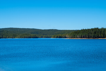 Blue dam with clear sky