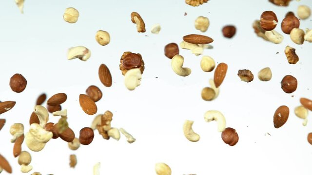 Super slow motion of flying mix nuts collision. Filmed on high speed cinema camera, 1000 fps.