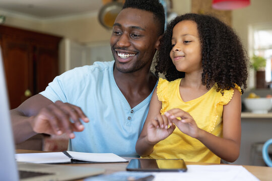 Father and Daughter social distancing at home during quarantine lockdown
