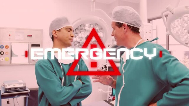Word Emergency written over red triangle over doctors working in a hospital background. Covid-19 spr