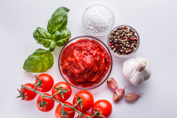 fresh natural tomato paste on a white background