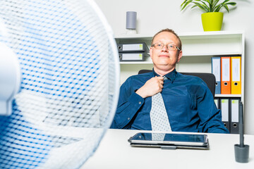 businessman works during a heat wave in the office