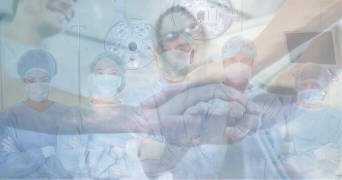 Animation of healthcare workers wearing Coronavirus Covid-19 mask and celebrating